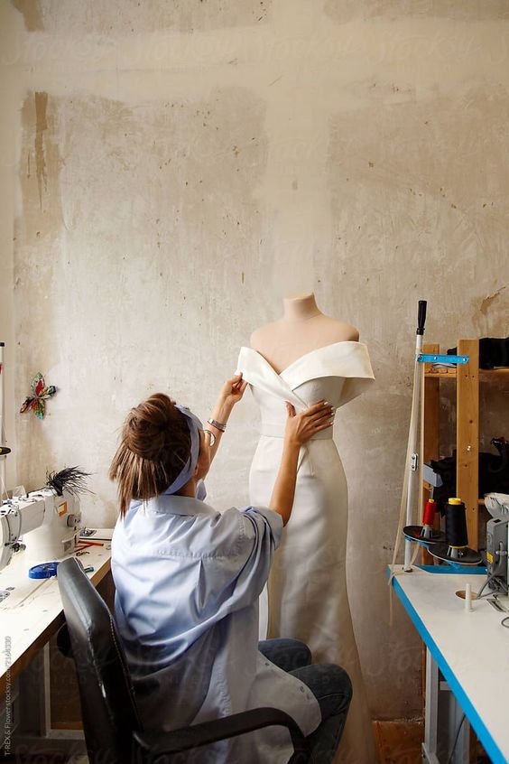 picture of a wedding dress designer making a dress